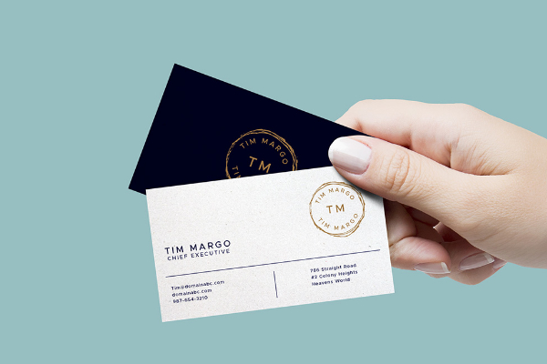 Hand holding business card